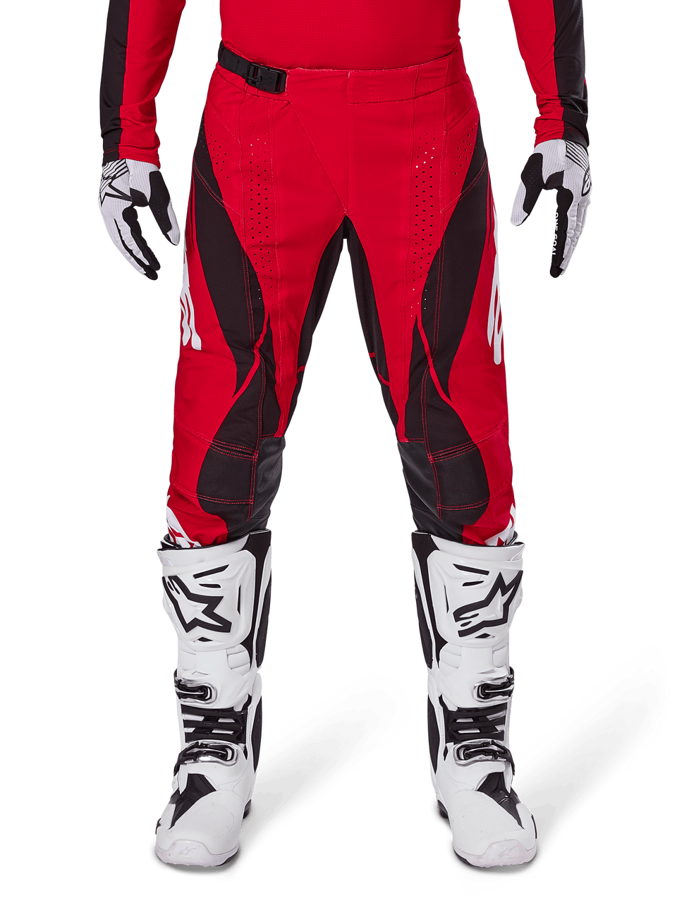 Alpinestars 2025 Techstar Dreem Pants, Motocross Pants, Bright Red and Black, featuring angular patterns and laser-cut ventilation holes, worn with white motocross boots and matching gloves for off-road racing