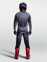 Alpinestars Racer Amber Pants, gray and light lilac motocross gear set for men, back view with red boots.