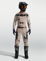 Alpinestars Racer Lone Pants and jersey, Men's Motocross gear set in Desert Camo Black, on model with racing boots.