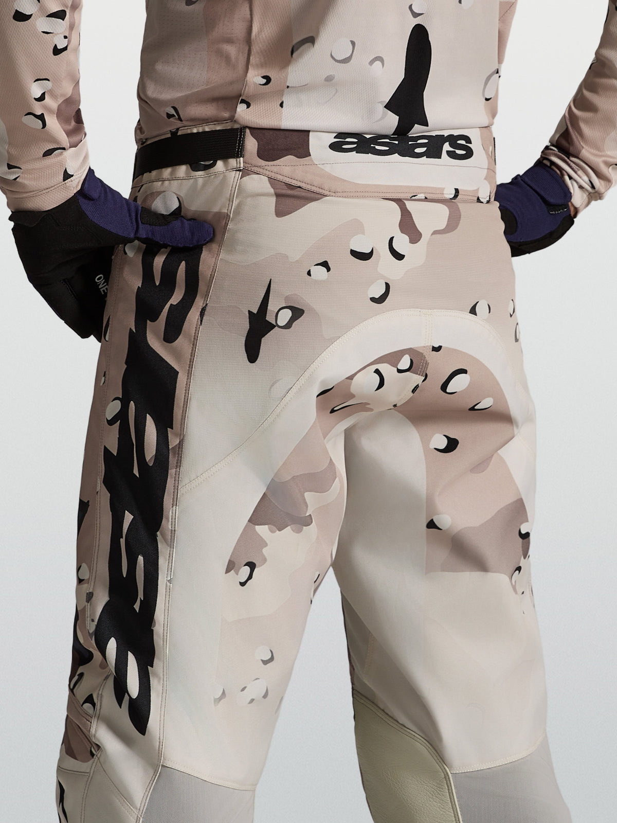 Alpinestars Racer Lone Pants, men's motocross gear in desert camo and black, rear view on-model showing performance race fit.