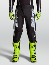 Alpinestars Fluid Apex V2 Pants, professional motocross performance pants in Black and Silver with ergonomic stretch panels.
