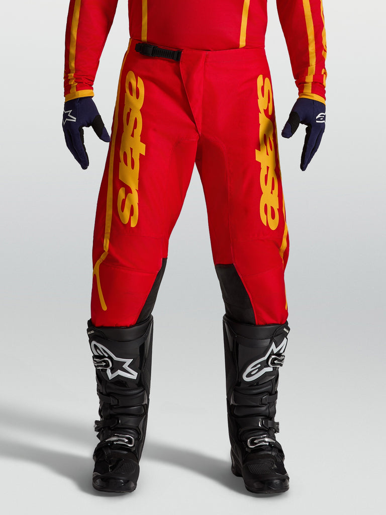 Alpinestars Fluid Apex V2 Pants, Men's Motocross pants in Red and Gold with durable 600D polyfabric reinforcement.