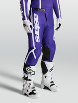 Alpinestars Fluid Apex V2 Pants, Men's Motocross Gear in Deep Blue and White, with durable 600D polyfabric and pre-curved legs.
