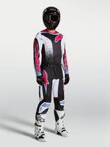 Alpinestars Fluid Drag Pants, men's motocross racing gear set in black and white with red fluo accents.