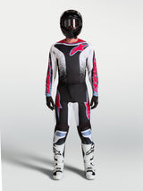 Alpinestars 2027 Fluid Drag Pants, black and white motocross gear with red and light blue accents, shown as a full gear set.