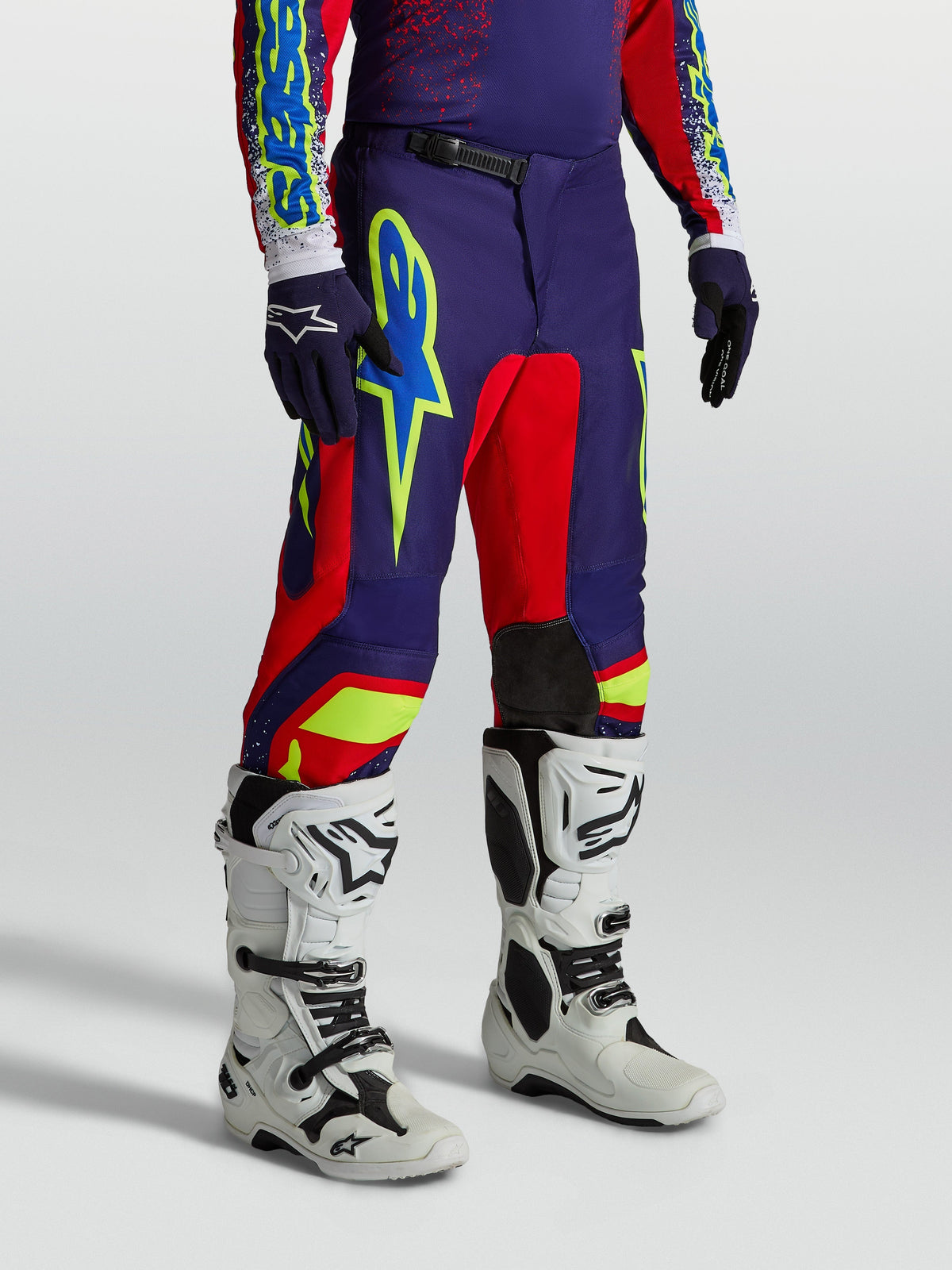Alpinestars Fluid Drag Pants, Men's Motocross Gear, Blue Navy and Red with bold graphics and white racing boots.