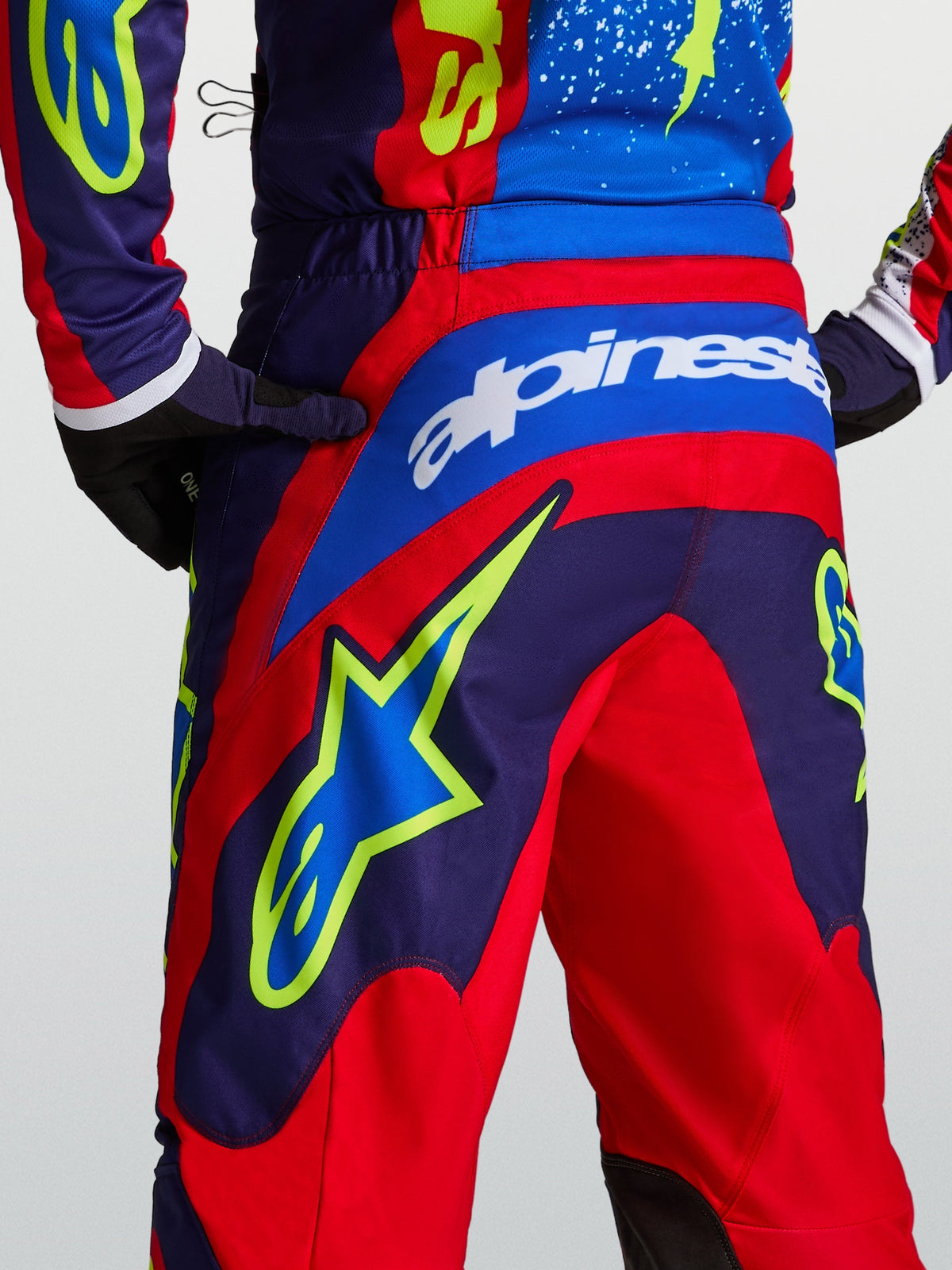 Alpinestars Fluid Drag Motocross Pants in Blue Navy and Fire Red with rear star graphics and a performance sport fit.