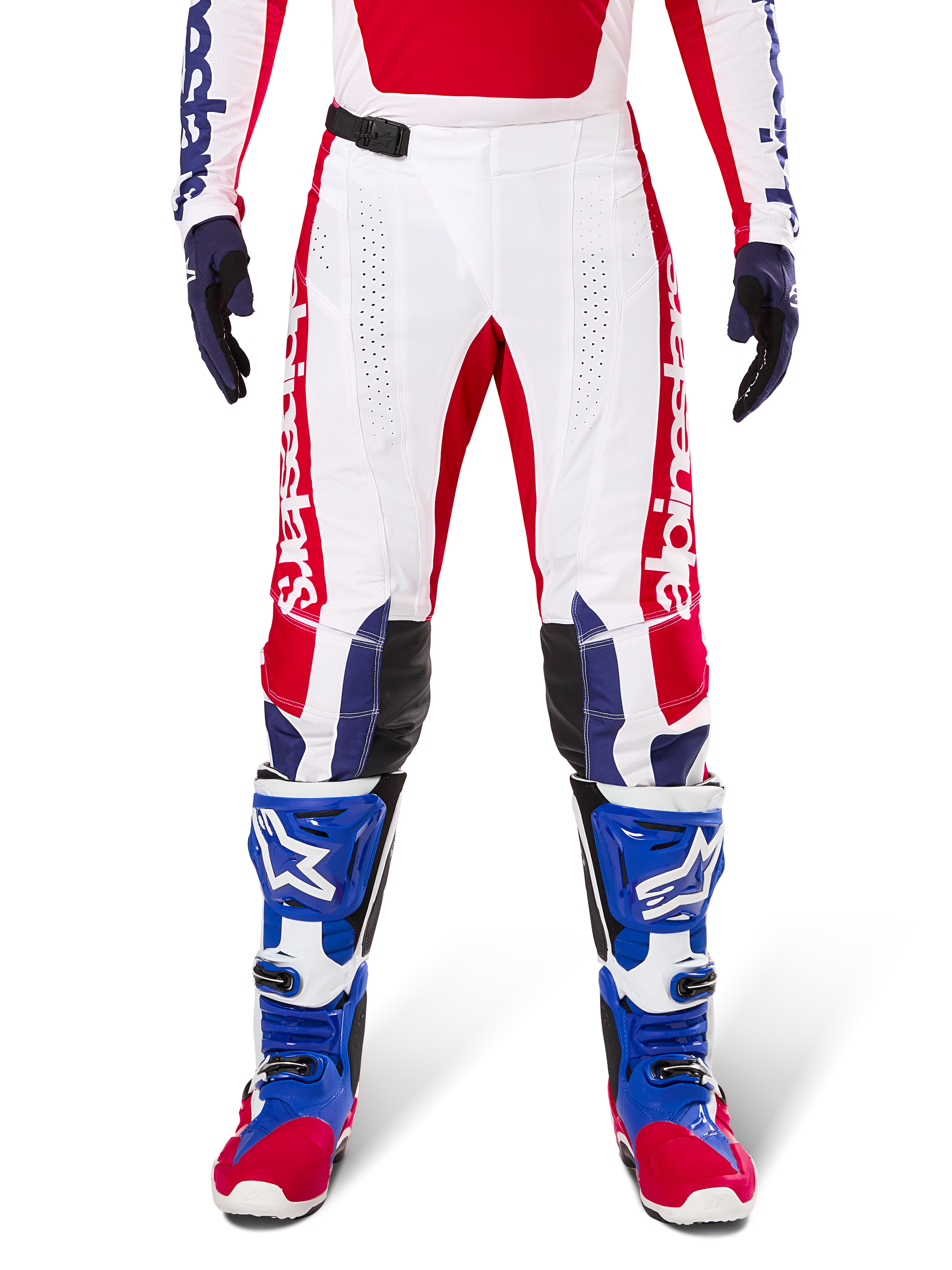 Limited Edition Techstar Fortitude Pants, Motocross Pants, Bright Red White and Blue, worn with matching gear including blue protective boots and gloves, featuring white chassis with red graphics, black leather knee panels, and laser-cut perforations, professional off-road racing apparel