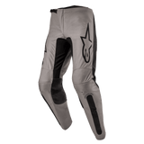 Alpinestars 2024 Fluid Lurv Pants, Motocross Pants, Mud Black, featuring a greyish-tan main chassis with black stretch panels on the inner legs and knees, prominent black Alpinestars logo on the thigh, ergonomic pre-curved design for off-road riding