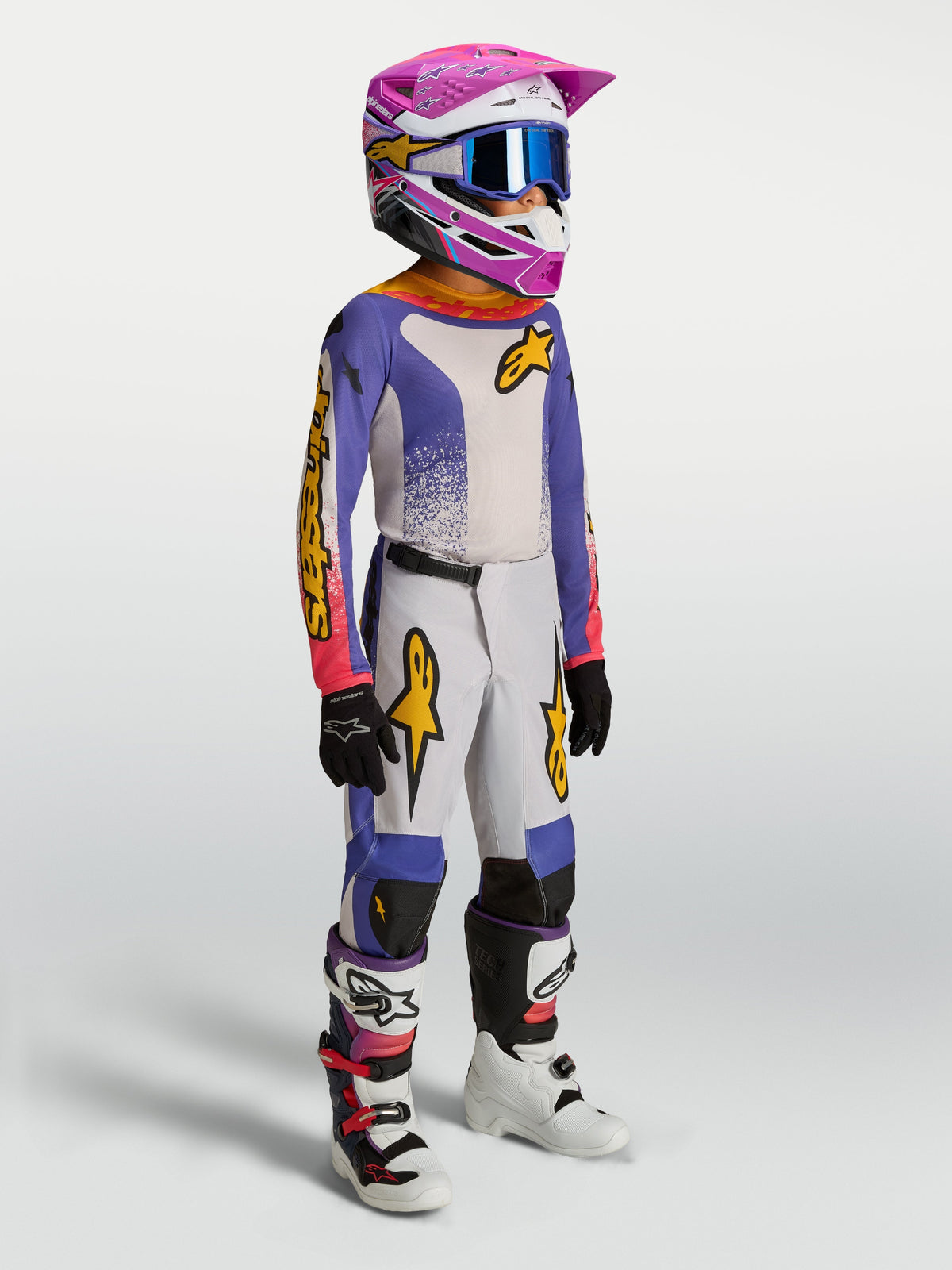 Alpinestars Youth Fluid Drag Pants, blue and gold motocross gear for youth riders, featuring durable textile and ergonomic fit.