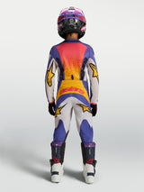Alpinestars Youth Fluid Drag Pants, blue and white youth motocross pants with yellow accents for durable off-road performance.