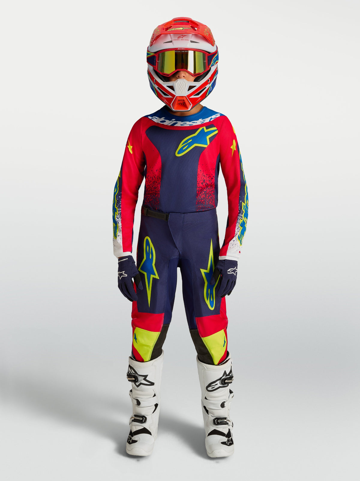 Alpinestars Youth Fluid Drag Pants, Blue Navy and Fire Red Motocross Pants, youth gear in 600D polyfabric shown on-model.