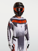 Alpinestars Techstar Swan Jersey, Motocross Top in Gray and Red Fluo, with race-fit stretch and laser-cut ventilation.