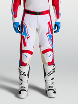 Alpinestars Racer Hunt Pants, performance motocross racing pants in white, fire red, and blue with ergonomic pre-curved legs and leather knee panels.