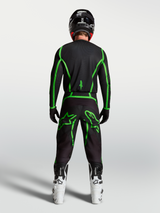 Alpinestars Fluid Apex V2 Jersey, motocross performance gear, black and green fluo, rear view on rider with white boots.