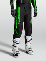 Alpinestars Fluid Apex V2 Pants, men's motocross performance gear in black and fluorescent green with reinforced 600D polyfabric.
