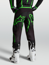Alpinestars Fluid Apex V2 Pants, Men's Motocross and Off-Road Pants, Black and Green Fluo, Rear View on Model with White Boots.
