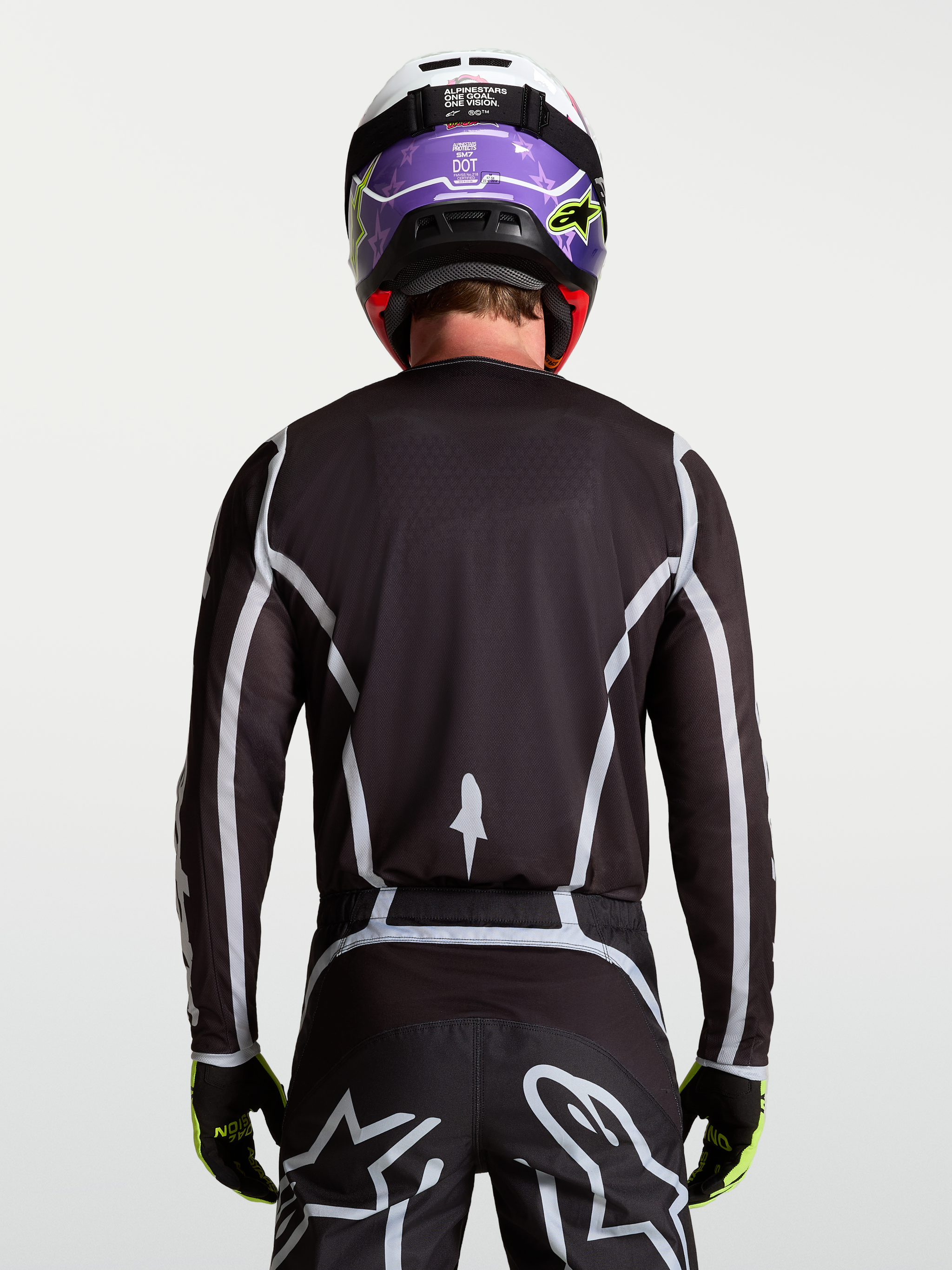 Alpinestars Fluid Apex V2 Jersey, Men's Motocross Jersey, Black and Silver, rear view on-model with ergonomic athletic fit.