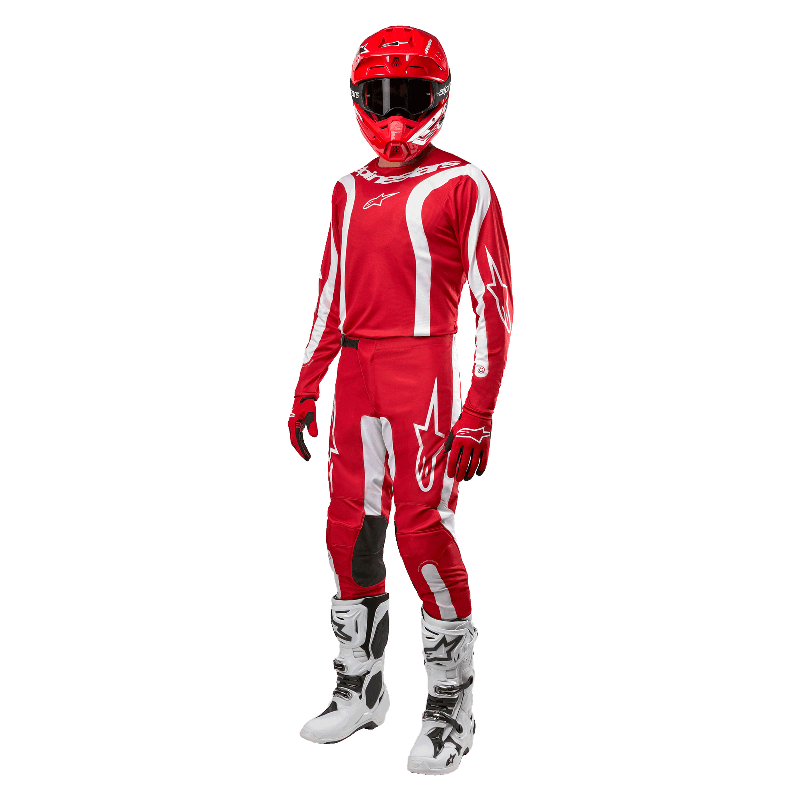Motocross rider wearing complete racing gear, Alpinestars 2024 Fluid Lurv Jersey in Mars Red and White, matching red pants with white accents, red helmet, red gloves, and white and black boots, coordinated outfit for off-road racing