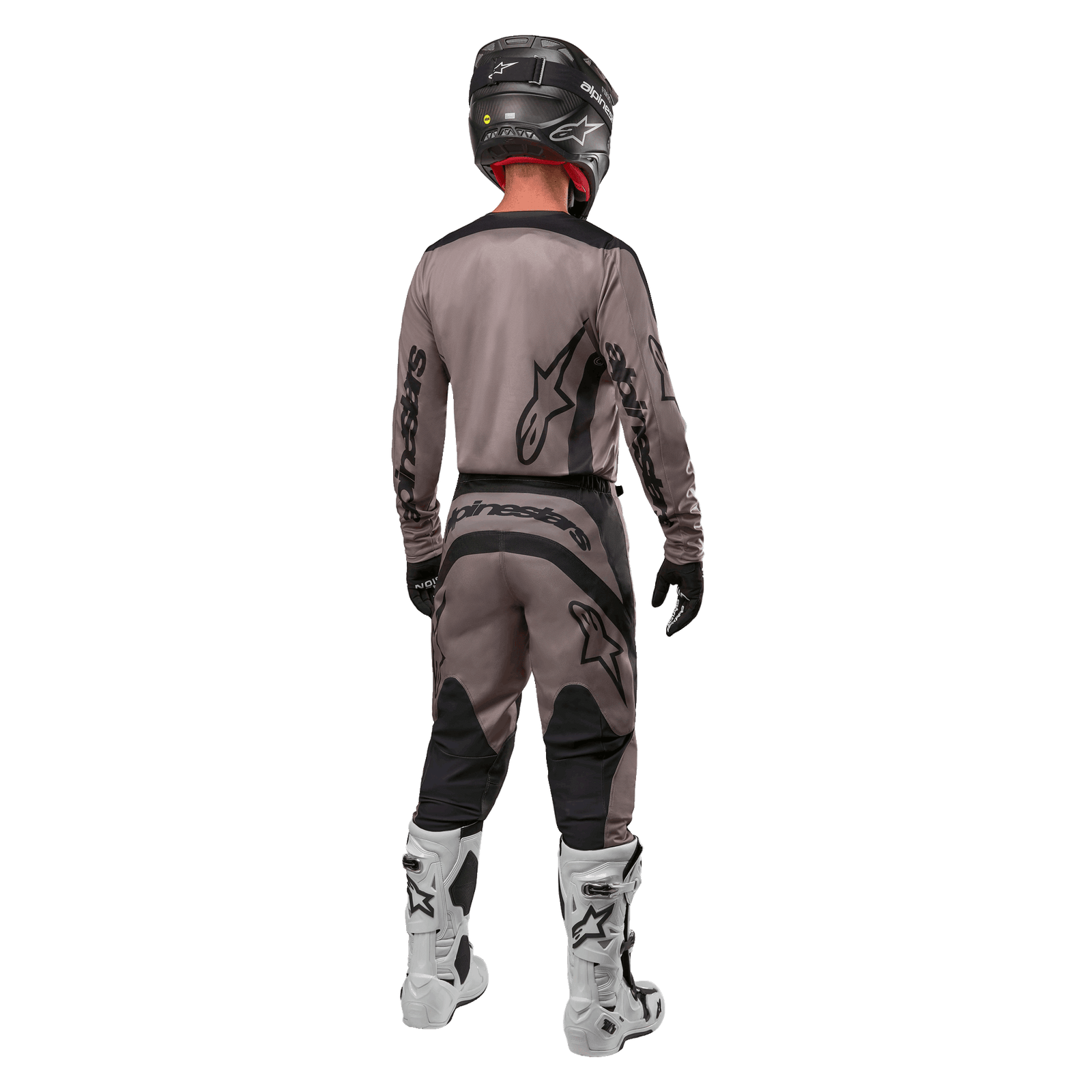 Alpinestars 2024 Fluid Lurv Jersey, Motocross Jersey, Mud Black, rear view of motocross rider wearing matching racing gear, black helmet, and white boots, featuring bold black Alpinestars logos and an athletic fit for off-road performance.