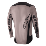 Alpinestars 2024 Fluid Lurv Jersey, Motocross Jersey, Mud Black, back view showing large Alpinestars branding on the sleeves and lower back, black panels on shoulders and sides, performance off-road riding gear