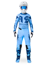Alpinestars Limited Edition Techstar Steeler Jersey, sapphire blue men's motocross gear set with matching pants and helmet.
