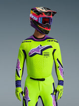 Alpinestars 2026 Supertech Vista Jersey, Motocross Jersey, Bright Neon Yellow with Purple and Black accents, worn with matching motocross helmet, goggles, and gloves, pro-level athletic fit for off-road racing