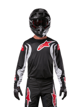 Alpinestars 2024 Fluid Lucent Jersey, Motocross Racing, Men, Black and White with Red logos, breathable poly-fabric chassis.