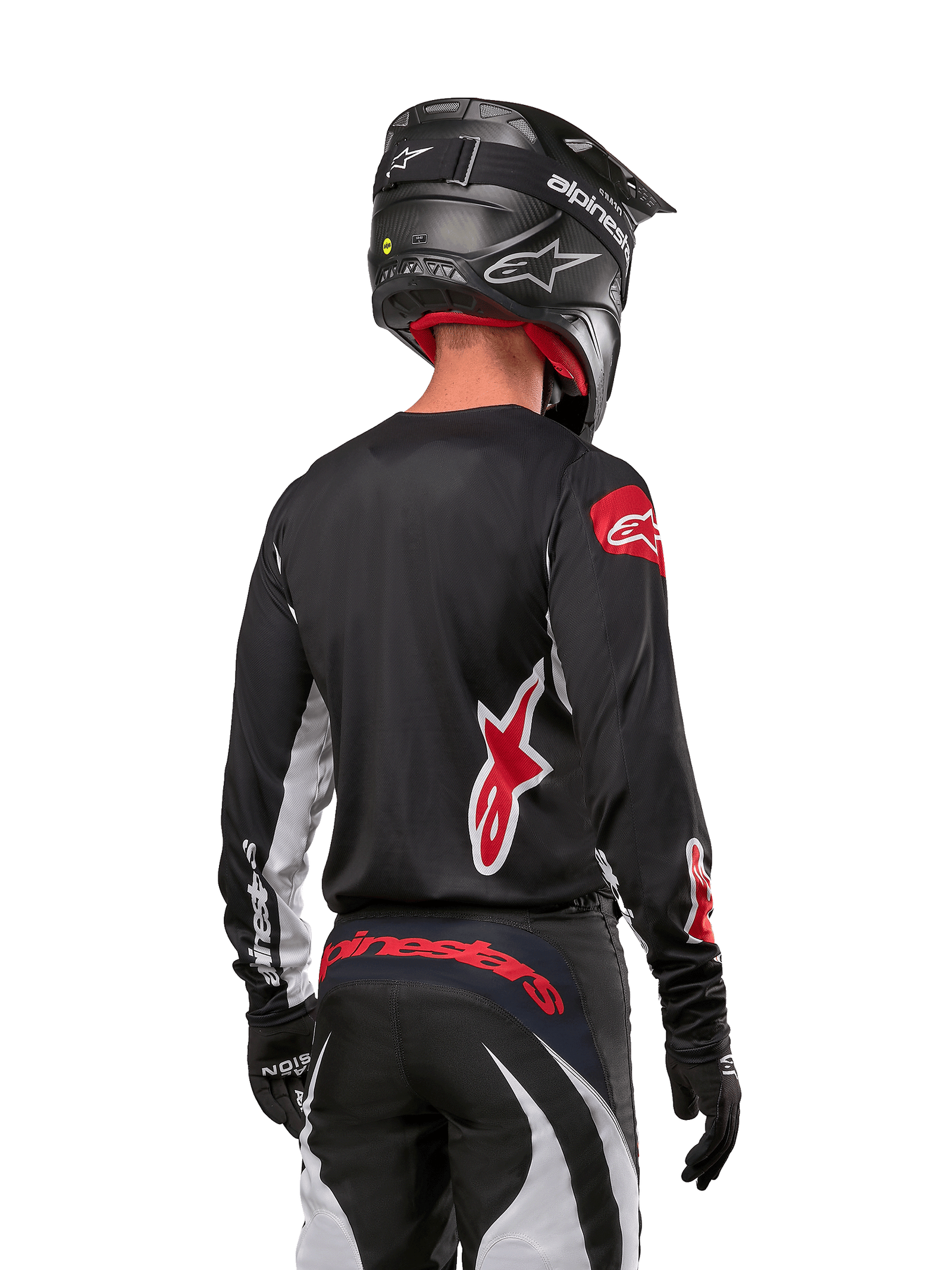 Alpinestars 2024 Fluid Lucent Jersey, Black and White motocross racing jersey with red logos, rear view on rider.