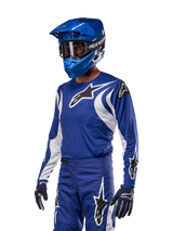 Alpinestars 2024 Fluid Lucent Jersey in Blue and White, worn for performance motocross and off-road riding.