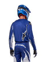 Alpinestars 2024 Fluid Lucent Jersey, Blue and White motocross racing gear, rear view of rider in athletic fit.