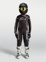 Alpinestars Youth Fluid Apex V2 Jersey and Gear Set, black and silver motocross outfit with white boots.