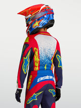 Alpinestars Youth Fluid Drag Jersey, red and navy blue youth motocross jersey with yellow graphics, rear view on rider.