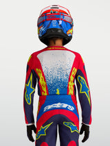 Alpinestars Youth Fluid Drag Jersey in Blue and Red, technical motocross racing top with ergonomic fit for young riders.