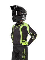 Alpinestars Youth 2024 Racer Lurv Jersey, Youth Motocross Jersey, Black and Yellow Fluo, moisture-wicking construction.