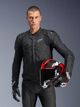 Alpinestars Dusk Leather Jacket, Black Men's Motorcycle Racing Jacket with Nucleon PLASMA armor and a red helmet.