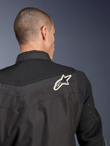 Alpinestars T-Dyno Air Jacket, Black textile motorcycle jacket, close-up back view highlighting the breathable 3D mesh yoke and sleeves, featuring a white and black star logo on the right shoulder.