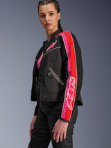 Alpinestars Woman Stella T-Dyno Air Jacket, Women's Motorcycle Jacket, Black with Bright Red and Fuchsia accents, worn with black pants, featuring pink Astars logo on the chest and sleeve, tailored biker fit with mesh panels for ventilation.