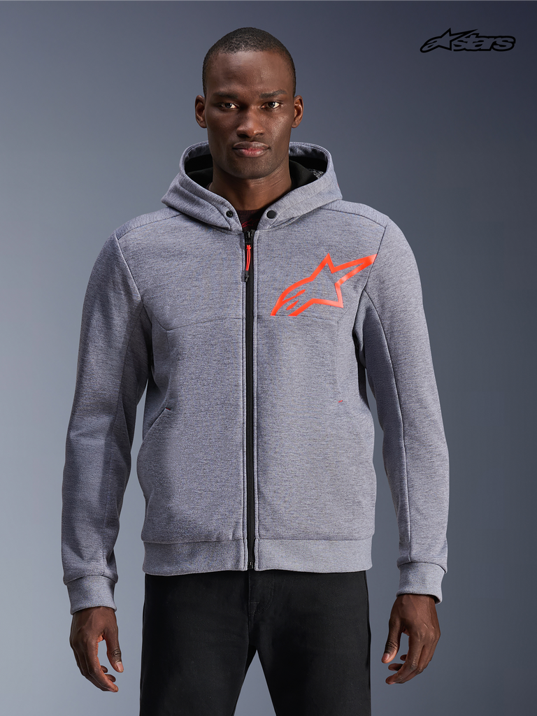 Alpinestars Chrome V2 Sport Hoodie, men's urban motorcycle hoodie in gray heather with red fluo accents, front view on a model showing tech fleece construction and protective zip styling.