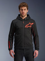Alpinestars Chrome Air Sport Hoodie, Black zip-up hoodie with red fluo star logo and sleeve accents, red mesh side panels for ventilation, casual urban riding gear worn by a model