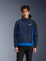 Alpinestars Radium Tech Hoodie, Urban Motorcycle Jacket, Night Navy and Royal Blue, featuring front zipper, white chest logo, and vertical branding, technical shell construction with an athletic fit