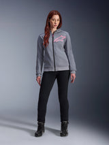 Alpinestars Stella Chrome V2 Sport Hoodie, Gray Heather Pink Fluo, worn by a woman with black pants and boots, featuring a pink Alpinestars star logo on the chest, full-zip urban motorcycle gear, lightweight tech fleece with a casual athletic fit.