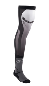 Alpinestars Knee Brace Socks, long motocross riding socks, Black White and Gray, over-the-knee design with stretch Lycra upper, mesh inserts, ribbed ankle padding, and Alpinestars branding on the thigh