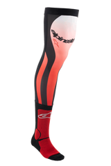 Alpinestars Knee Brace Socks, Long Motocross Riding Socks, Bright Red White and Black, knee-high technical design with gradient pattern and bold branding, ribbed texture for secure fit, specifically engineered for use with off-road boots and knee braces