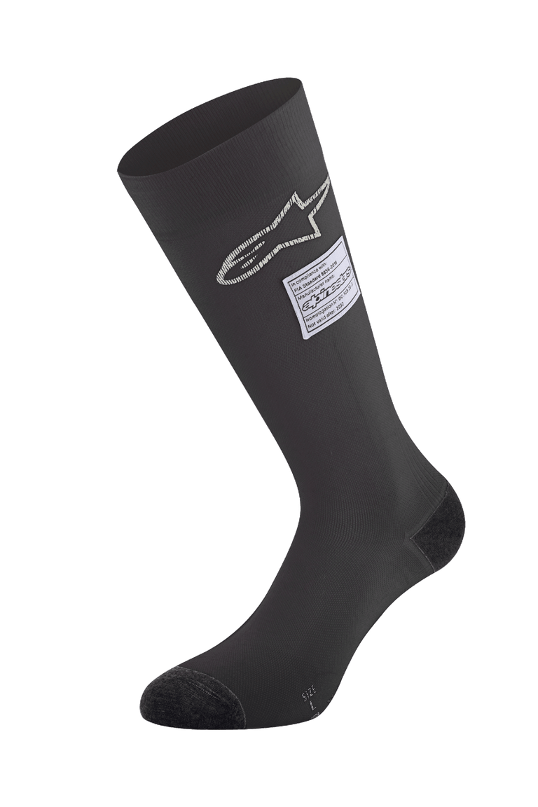 Alpinestars ZX V4 Socks, Black Auto Racing Socks, featuring white star logo and FIA certification label, knee-high seamless design with reinforced toe and heel, fire-retardant base layer for motorsport