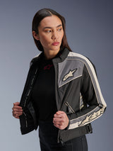 Alpinestars Woman Stella T-Dyno WR Jacket, textile motorcycle jacket, Black Dark Gray and Ecru, vintage-inspired design with sporty stripes and logos on chest and sleeves, worn by a model, urban road riding gear