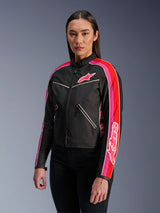 Woman wearing the Alpinestars Stella T-Dyno WR Jacket in Black Bright Red Fuchsia, textile motorcycle jacket with a vintage-inspired biker fit, featuring vibrant fuchsia and red stripes on the sleeves and a chest logo, paired with black pants.