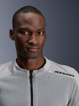 Alpinestars C-1 Air Jacket in Silver and Gray, close-up portrait of a male rider, featuring technical mesh panels and black branding on the shoulder, urban contemporary motorcycle gear
