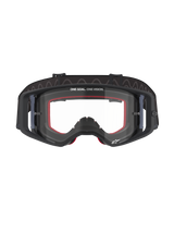Alpinestars Supertech Corp Goggles, Motocross Goggles, Black frame with Clear lens, featuring red internal face foam, 'ONE GOAL. ONE VISION.' text on the upper lens, and black silicone-backed strap, professional off-road racing eyewear