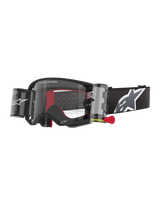 Alpinestars Supertech Corp Goggles Roll Off, Black frame with Clear lens, featuring a Wide Vision Roll-Off system and red pull tab, black strap with a large grey and white Alpinestars logo, technical motocross eyewear with "One Goal. One Vision." branding.